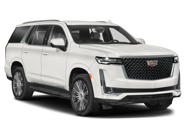 A white cadillac SUV with a bold design, large grille, vertical LED headlights, and black alloy wheels